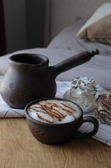 Homemade marshmallow zephyr with clay cup of cappuccino