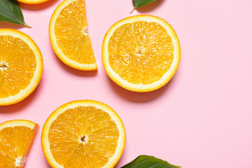 Fresh orange slices on color background