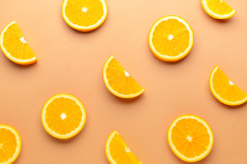 Fresh orange slices on color background
