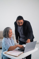 women entrepreneurs and business people discussing and using laptop