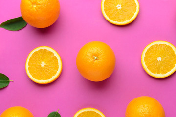 Fresh oranges on color background