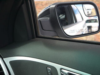 Police car in rear view mirror view from pulled car