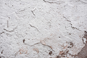 Texture of a concrete wall with cracks and scratches which can be used as a background