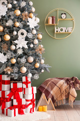 Interior of room with decorated Christmas tree