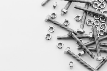Nuts and bolts closeup on white background