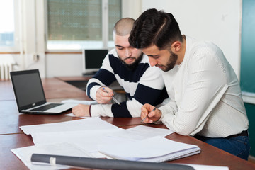 Students preparing for exams in classroom