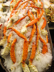 king crab legs on ice at market
