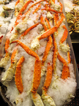 king crab legs on ice at market