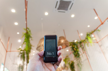 Close-up of a tracking transmitter in a coffee shop.