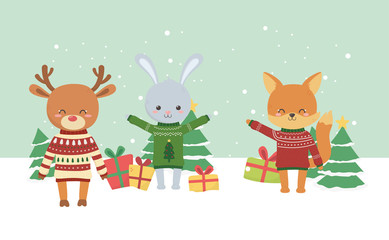 Obraz na płótnie Canvas merry christmas celebration cute fox deer rabbit tree gifts snow