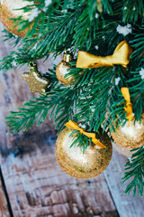 Christmas background. Green fir tree with golden balls and gift boxes. - 303988560