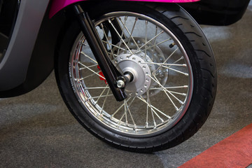 Fototapeta na wymiar wheel of bicycle/motorcycle on the road