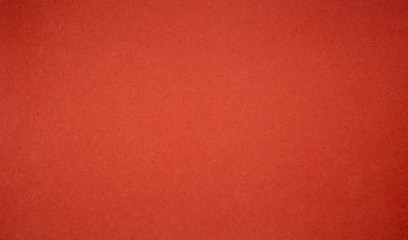 Fototapeta premium Background from a red perfect suede fabric. Velvet texture