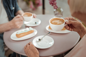 Selective focus of a cup with delicious coffee