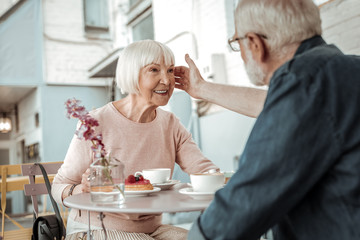 Nice joyful woman feeling the love of her husband