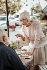 Nice aged woman arguing with her husband