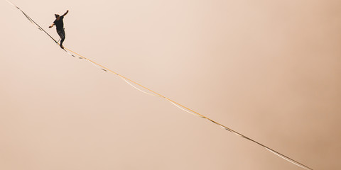 Highliner goes on a sling above the clouds.