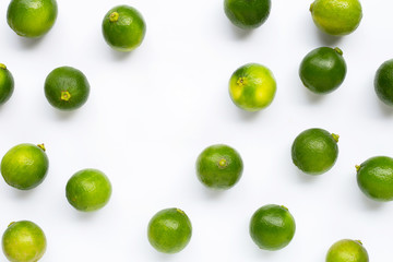 Fresh limes with leaves isolated on white