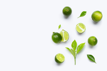 Limes with leaves isolated on white background.