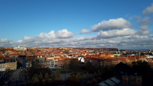 Timelapse on a cloudy day in a Scandinavian city red rooftops