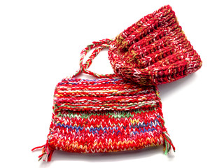 Knit hat and handbag isolated on white background. Composition of hat and handbag. Handmade hat and handbag.