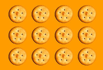 salty biscuits on orange background