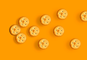 Fototapeta premium salty biscuits on orange background