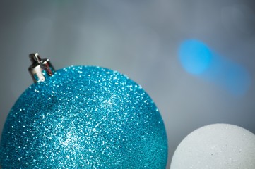 Christmas background with shiny colored toys.