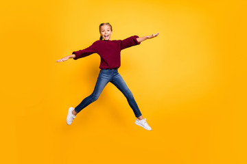 Fototapeta na wymiar Full length body size view of nice attractive lovely carefree glad girlish cheerful cheery pre-teen girl jumping having fun flying isolated on bright vivid shine vibrant yellow color background