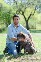 man and dog in park