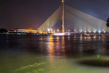 Fototapeta na wymiar Rama VIII Bridge at night in Bangkok, Thailand