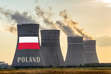 Nuclear plant chimneys displaying flag of Poland with according text. Energy pollution accidents in the country concept. Power production and generation from atomic energy.