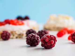 Blueberry berries closeup and other fruits on Breakfast background