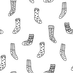 Vector seamless pattern with cute hygge socks on white background. Great print  for fabric, wrapping papers, wallpapers, fabric, cover. Doodle style illustration in black ink, outline.