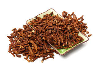 Dried medicinal herbs raw materials isolated on white. Root of Taraxacum. Blossom, dandelions.