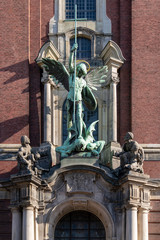 Fototapeta na wymiar statue st. michaelis cathedral over the entrance in hamburg, germany