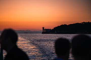 Dramatic view of the tourist spot Castello di Miamare (Castle of Miramare) in Trieste, Italy on the Mediterranean sea coast in europe while sunset.