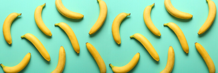 Many sweet ripe bananas on color background