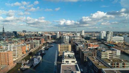 hafencity hamburg cityscape with many boats, modern houses and clouds, germany