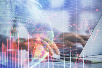 Double exposure of forex graph with man working on computer on background. Concept of market analysis.
