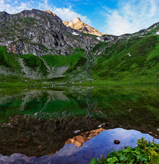 lake in the caucasus mountains on a summer morning