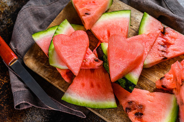 Slices of ripe watermelon on a wooden cutting Board. Selective focus