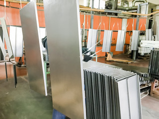 Powder coating line. Industrial interior. Workshop equipped with conveyors.