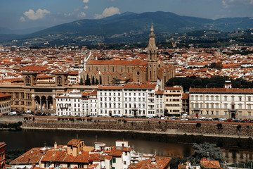 Panoramic view from Piazza Michelangelo on the ancient building of wild stone with a sharp spire on...