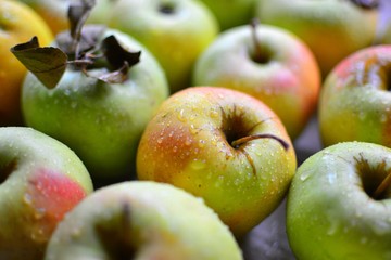 Juicy ripe apples. Yellow-green apples in a wooden box