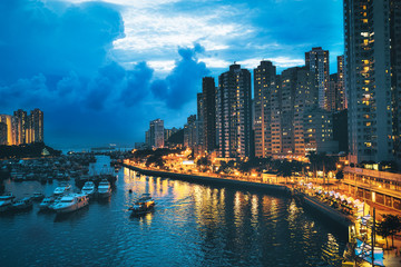 Fototapeta na wymiar Aberdeen, Hong Kong seen from Ap Lei Chau Bridge, in night time