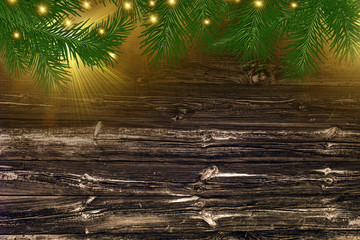 Christmas background for advertising or greetings. wooden background, spruce and glow.