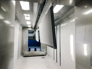 Powder coating of metal parts in factory