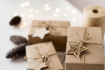 Christmas gift box made of Kraft paper on white background. Packaging in rustic style.