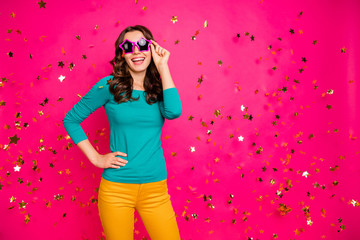Obraz na płótnie Canvas Photo of cheerful positive nice pretty fascinating girlish feminine youngster holding eyeglasses spectacles in yellow pants trousers isolated bright color fuchsia background